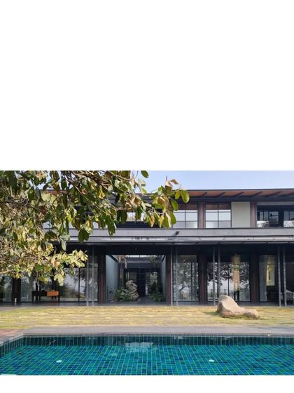 The completed Lakeshore house, now occupied. The home is designed to disappear behind the first line of trees when viewed from the water, a testament to its integration with the natural landscape.