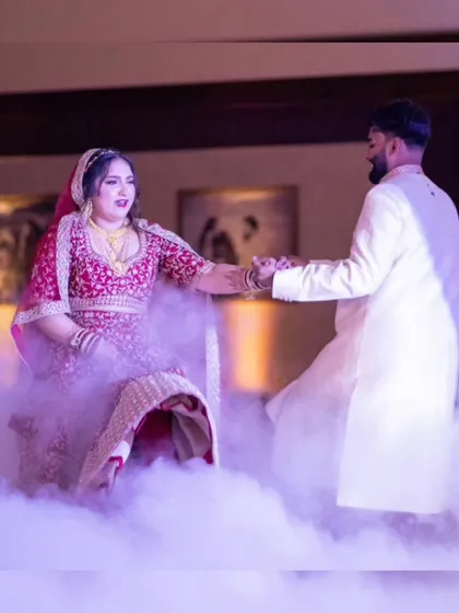 A romantic moment choreographed for a reception dance. We design routines that are easy to learn and look beautiful on stage, even with dramatic effects like low-lying fog.