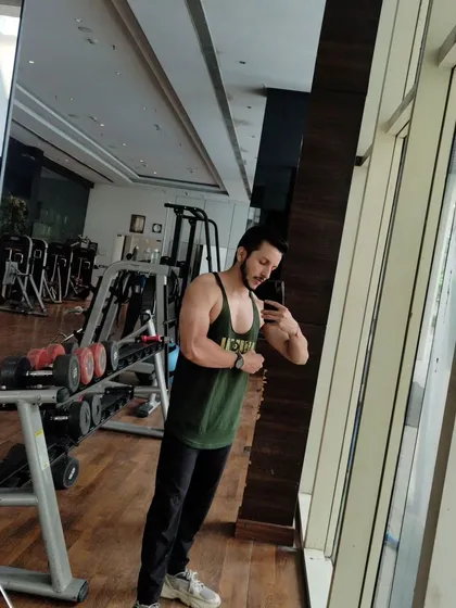 A full-body shot in the gym. My goal is to help clients build an aesthetic and functional physique.
