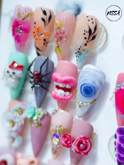 Your nails are a canvas for your personality. This collection shows the creative range we offer, from playful 3D spiders and lips to detailed floral patterns. If you can imagine it, I can create it.