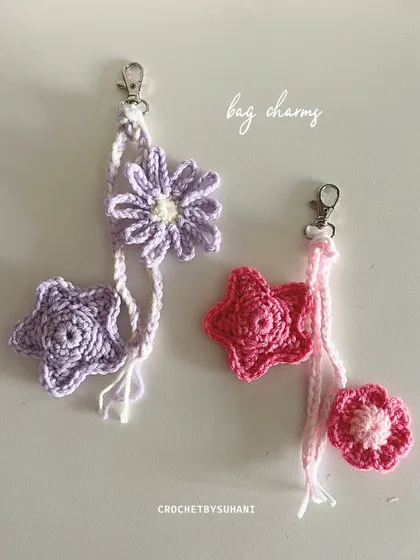 A beautiful combination of my floral and star designs. These bag charms feature a braided hanger and are shown in coordinating lavender and pink colorways.