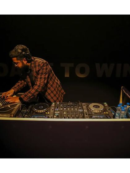 In my zone at the Taj Convention Centre in Agra. The backdrop says 'Dare to Win', a motto I bring to every performance.