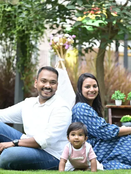 A perfect day for a family portrait outdoors. This session in a beautiful Bangalore park shows how natural light and a relaxed setting can bring out the most genuine smiles and happy moments between parents and their little one.