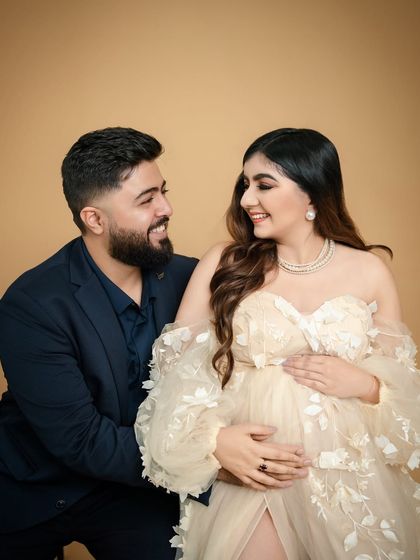 A look of pure love. This candid moment captures the couple sharing a smile, their excitement and affection for each other shining through.