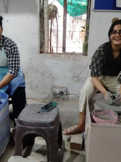 Celebrating a special day with a pottery session. This couple is enjoying their time at the wheels, making memories and art at the same time.