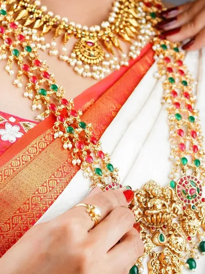 For fashion and jewelry shoots, we capture the product with as much care as the model. This detailed shot focuses on the intricate design of a traditional temple jewelry necklace, highlighting the colorful stones and craftsmanship.