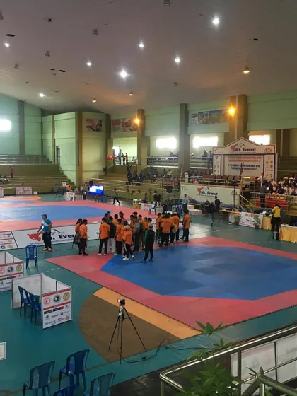 The warm-up and staging area at the Mt. Everest G-2 event, with athletes from different regions preparing to compete.