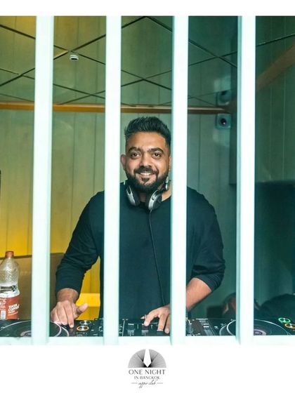 A shot of me behind the bars of the unique DJ booth at 'One Night in Bangkok'. Always a good time playing here.
