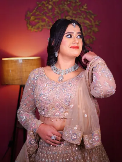 A three-quarter shot showing the unique peplum blouse and the flow of the lehenga.