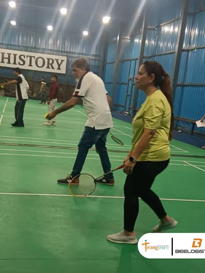 Another angle of the on-court action, showing colleagues enjoying a healthy and active day out of the office.