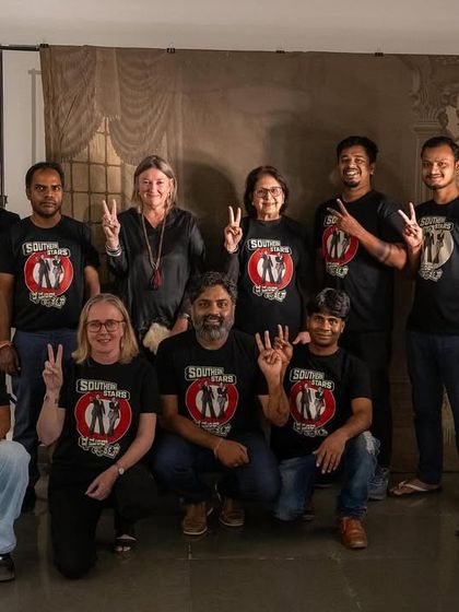 The Gallery Sumukha team wearing matching t-shirts for the 'SOUTHERN STARS' opening night, a fun moment of unity.