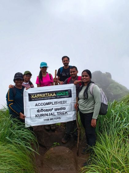 Accomplished. Our group at the summit of Kurinjal peak, holding our banner high.