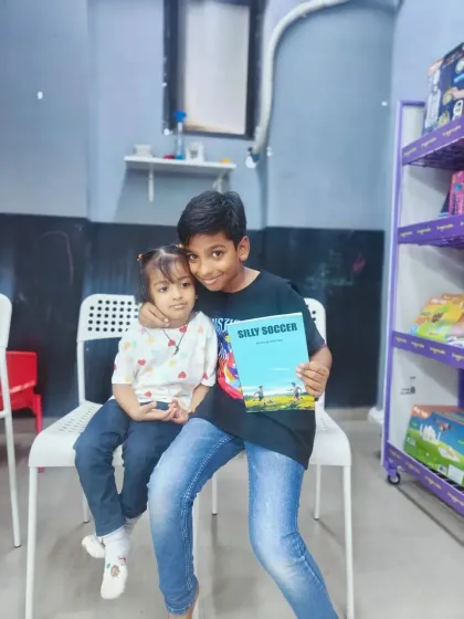 A heartwarming moment between the young author of 'Silly Soccer' and one of the youngest members of the audience. This club creates beautiful connections between children of different ages.