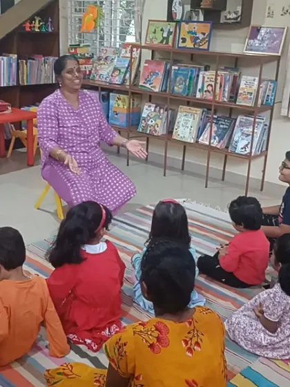 With open arms, our storyteller narrates a magical tale about a paintbrush. We use expressive body language to convey the emotions and actions in the story.