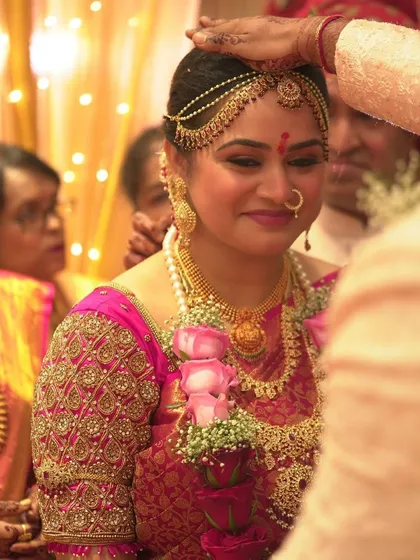 A candid moment during the ceremony, her makeup looking flawless even in the midst of all the rituals.