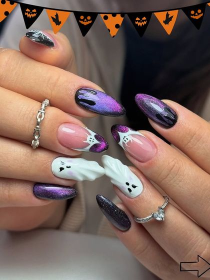 We love this 3D ghost design for Halloween. Combined with a purple and black cat-eye polish, this set is both spooky and incredibly cool.