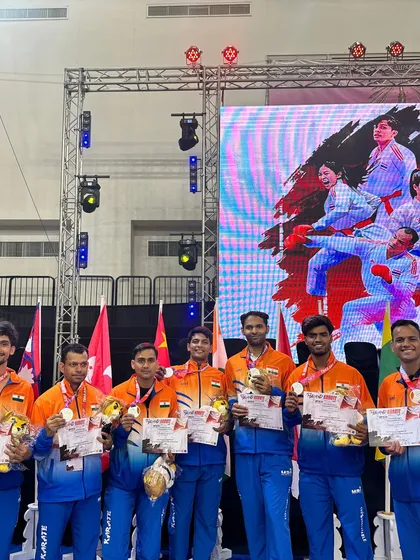 Our strength is in our team. The Karate India Academy team stands victorious on stage at the Thailand Open Karate Championship, showcasing the collective success of our dedicated fighters.