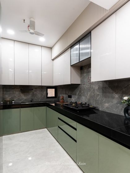 A different angle of our olive green and grey kitchen, showcasing the clean lines and minimal hardware. The design keeps the look cohesive and contemporary, making this kitchen as stylish as it is functional.
