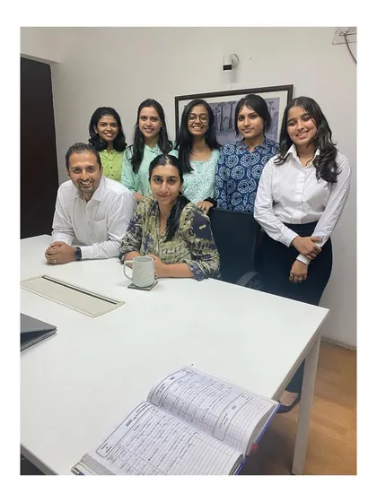 The full team, including our interns, gathered in the conference room.