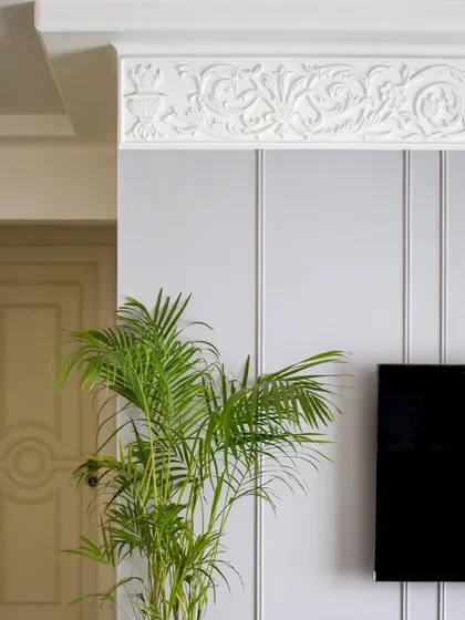 A detail shot of the ornamental moulding on the TV wall. This kind of craftsmanship is what sets our projects apart.