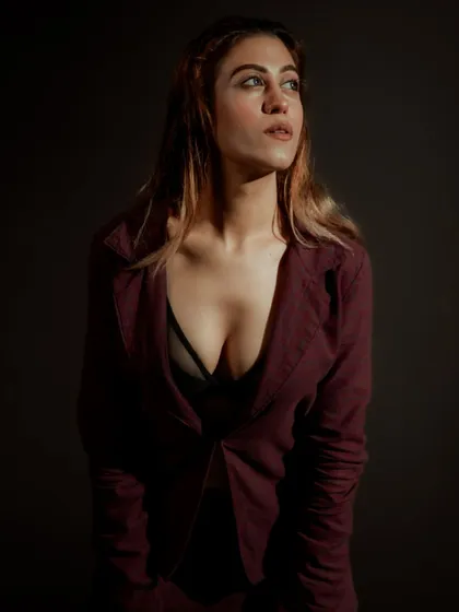 A close-up portrait where the light catches the model's gaze. This style of lighting creates a cinematic and thoughtful mood, perfect for an actor's headshot or a model's beauty shot.