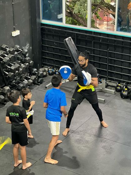 Always watching, always learning. Younger students learn so much by observing the older Kikkers and coaches during drills.