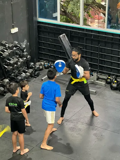Always watching, always learning. Younger students are inspired by watching the senior members and coaches train.