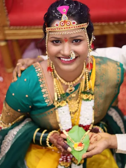 A beautiful portrait of the bride during a wedding ritual, wearing the traditional 'bashing' on her forehead.