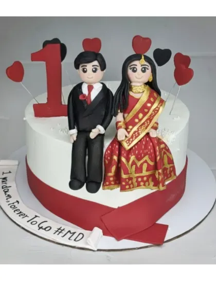 Celebrating one year down and forever to go with this custom anniversary cake. It's an eggless chocolate truffle flavor, featuring adorable handmade fondant figures of the couple.