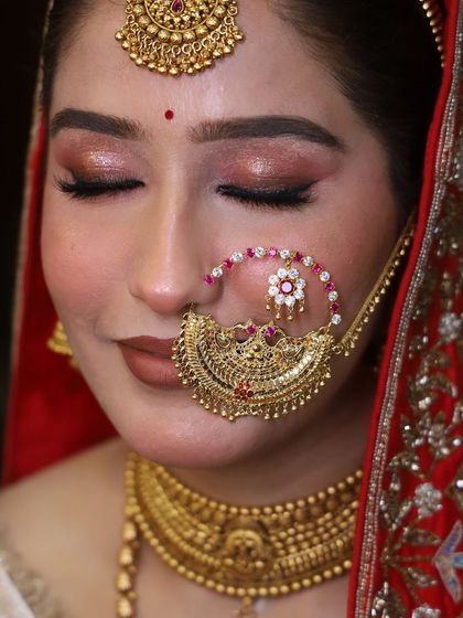A close-up of a bridal look, focusing on the soft bronze eye makeup and a classic nude lip, a versatile look for many brides.