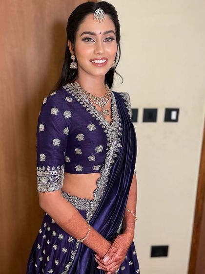 The full look is a perfect example of modern elegance. The makeup is flawless, the hair is chic, and the smile is genuine.