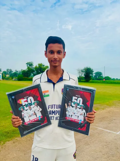 Aditya proudly displays his awards. His hard work and motivation are paying off.