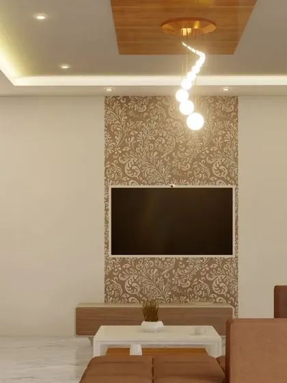 A close-up of the reception and TV area in a commercial space, highlighting the textured accent wall and the modern, spiral pendant light.