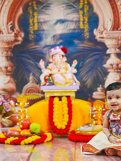 A bright smile from our little participant, perfectly capturing the happy spirit of the Ganesh festival.