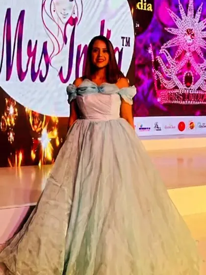 I was so proud to see my dress on the Mrs. India 2024 stage. This light blue off-shoulder ball gown is truly fit for a queen, perfect for pageants, receptions, or any event where you want to shine.