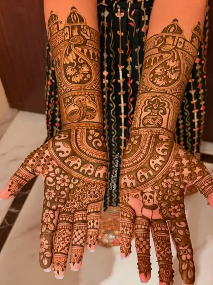 A special request for a bridal design with a cute panda. This full coverage mehendi combines traditional motifs like elephants and palaces with a personal touch.