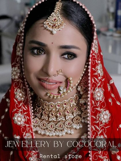 A beautiful bride wearing the red and pearl kundan set from my rental store. It perfectly complements her traditional red bridal outfit.