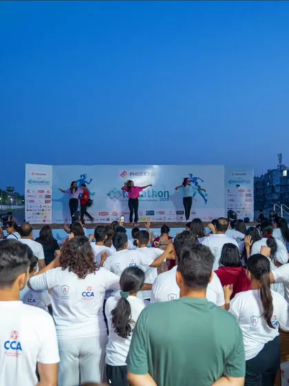 The participants mirroring our moves from the stage. It's a beautiful sight of unity and shared purpose.