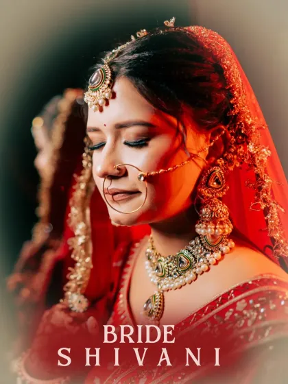 A quiet moment of reflection for the bride. This portrait, with its soft focus and warm lighting, captures the serene beauty and emotion just before the wedding ceremonies begin.