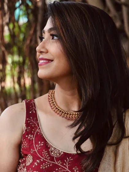 For another event, we switched to this gorgeous maroon and gold lehenga. This close-up shows the soft, subtle makeup with a focus on a pretty berry lip color.