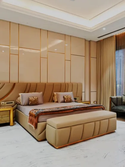 In this bedroom, we combined soft textures with clean, geometric wall paneling to create a sanctuary that is both modern and deeply comfortable. The design ensures a feeling of rest and elegance.