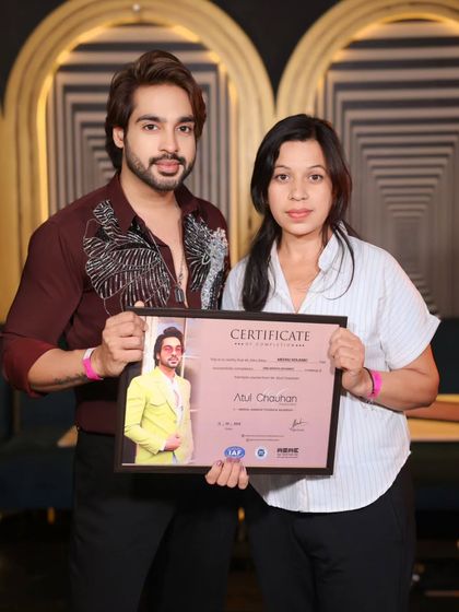 A student receiving her certificate. Her hard work and practice paid off.