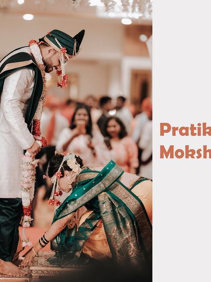 A moment of respect and tradition. The bride touches the groom's feet, a significant ritual in many Indian weddings, captured with grace and cultural sensitivity.