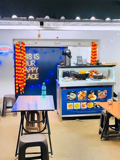 Our little food stall decorated for the festive season. The "This Is Our Happy Place" sign is always lit up, welcoming everyone.