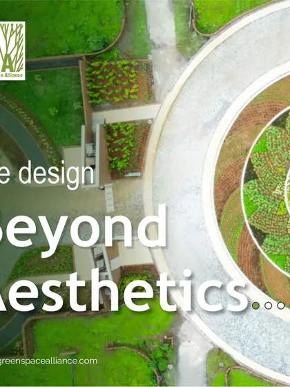 A graphic stating "We design Beyond Aesthetics," set against an aerial view of a geometrically patterned landscape. This reinforces our commitment to creating spaces that enhance human well-being, environmental health, and community engagement.
