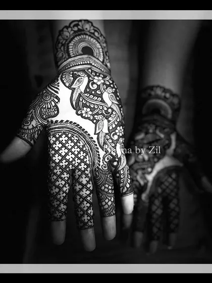 A black and white photo that highlights the beautiful contrast and line work of a traditional bird and jaal pattern.