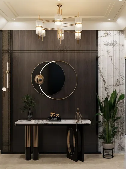This foyer space sets the tone for the rest of the home. It features a dark wood paneled wall, a modern circular mirror, and a sleek console table, creating a sophisticated and welcoming entrance.