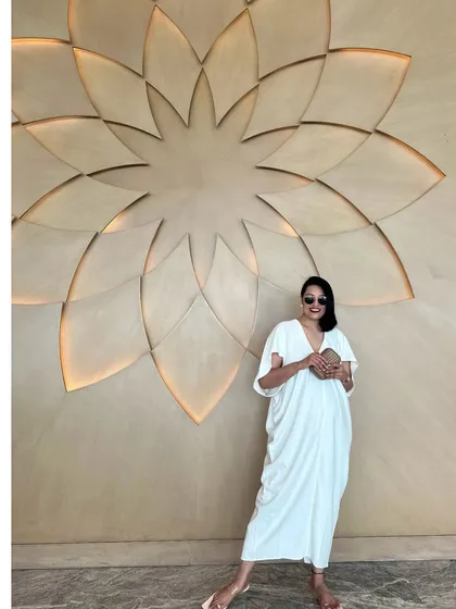 Effortless elegance in a simple white kaftan. This is a timeless piece that belongs in every resort wardrobe.
