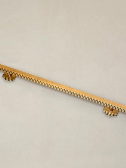 Our Natali Door Pull is a study in Art Deco geometry. The clean, stepped lines and strong vertical form create a handle that is both modern and timeless. It is available with both small and long backplate options to suit various door styles.