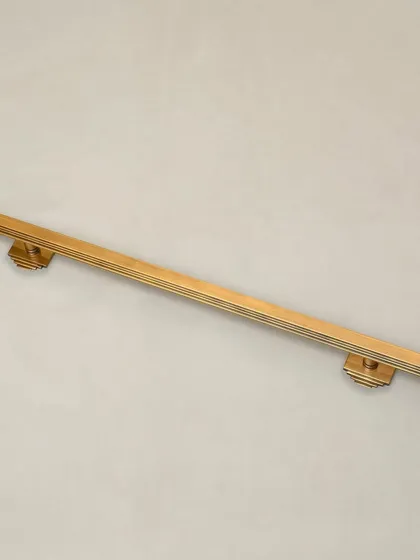 Our Natali Door Pull is a study in Art Deco geometry. The clean, stepped lines and strong vertical form create a handle that is both modern and timeless. It is available with both small and long backplate options to suit various door styles.